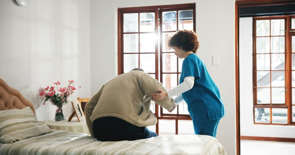 Man receiving assistance in a care home